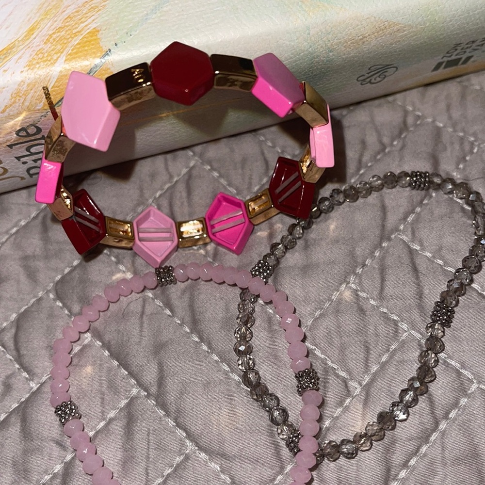 Pink and gray assortment of bracelets